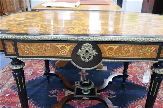 A Louis XVI style marquetry inlaid centre table, with shaped X stretcher W.127cm